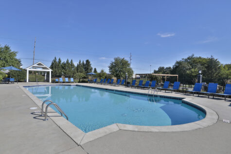 Waterford Place resort style swimming pool with sundeck and lounge chairs