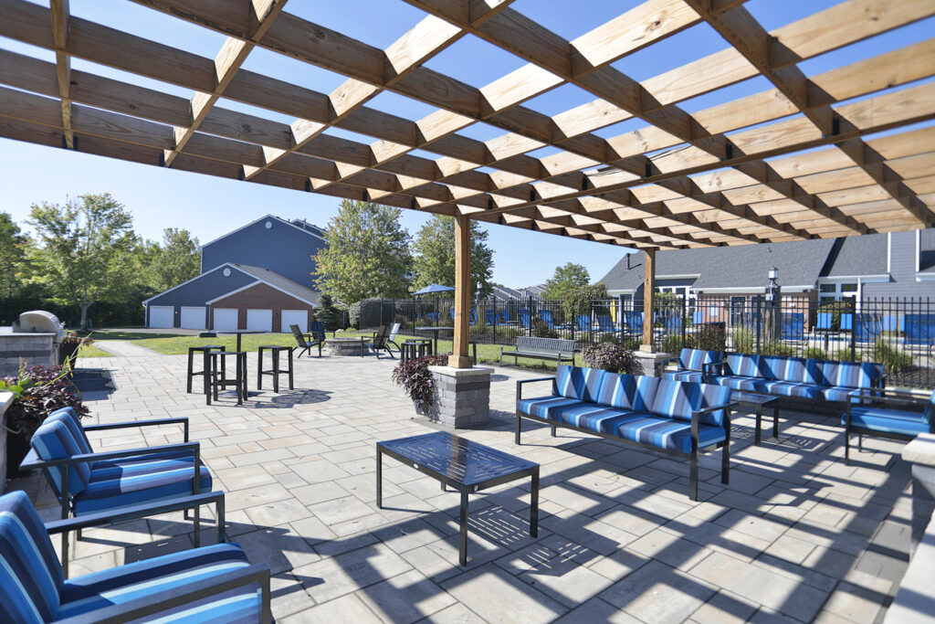 Waterford Place social deck with high-top table seating and grilling stations