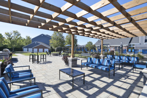 Waterford Place social deck with high-top table seating and grilling stations