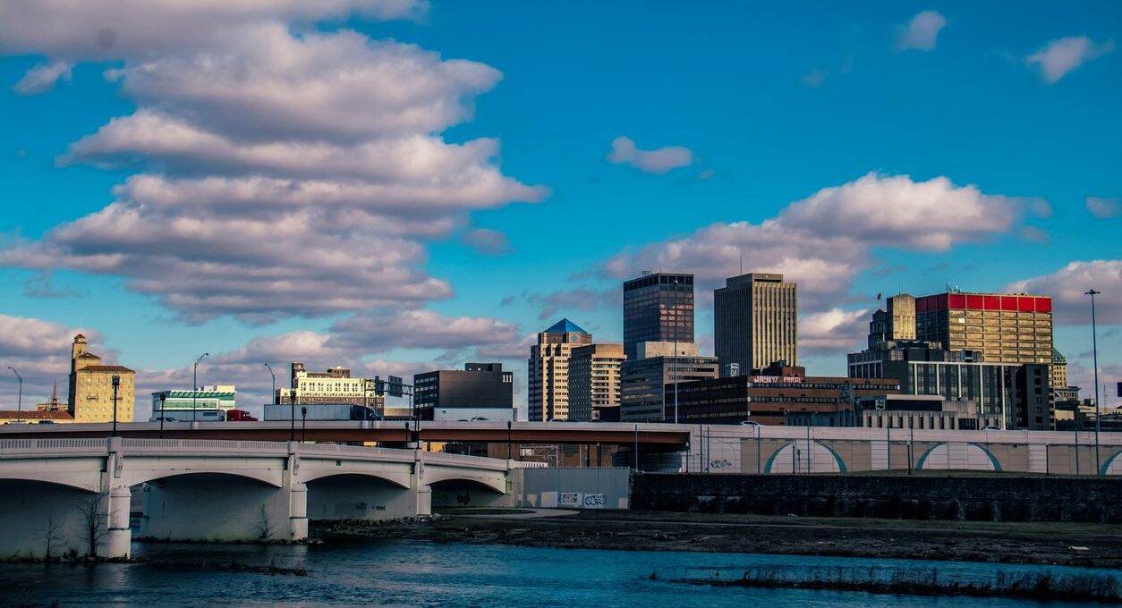 The skyline of Dayton, OH, with beautiful clouds dotting the blue skies above.