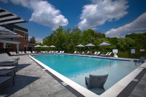 Cool off in the resort-inspired pool with spacious tanning ledges, shaded lounge areas, and modern finishes designed for both relaxation and recreation all summer long.