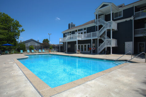 Outdoor swimming pool at Island Club Apartments in Deerfield Township, Ohio, featuring a relaxing atmosphere and resort-inspired amenities.