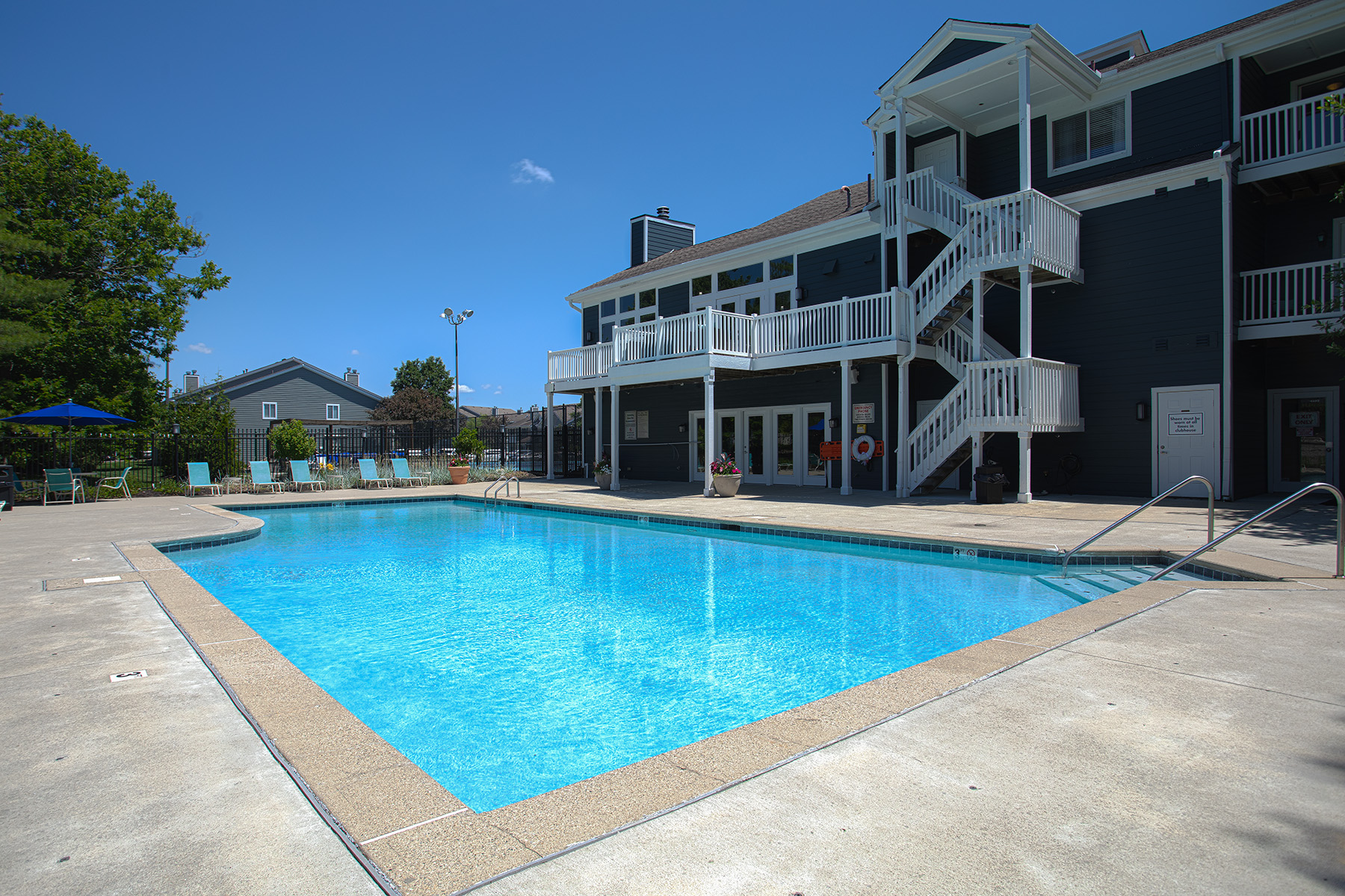 Outdoor swimming pool at Island Club Apartments in Deerfield Township, Ohio, featuring a relaxing atmosphere and resort-inspired amenities.