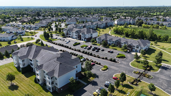 Aerial view of apartment homes at Palmera Apartments in Mason, Ohio, featuring tree-lined streets, landscaped courtyards, and peaceful residential surroundings.