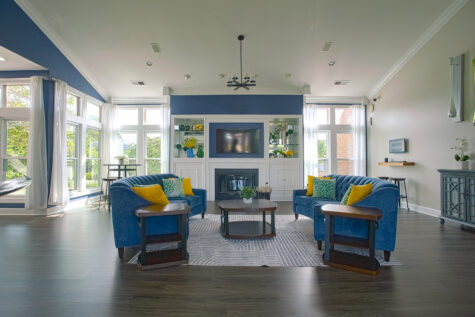 Bright and inviting clubhouse interior at Waterford Place Apartments in Loveland, Ohio, offering comfortable seating areas and community gathering spaces.