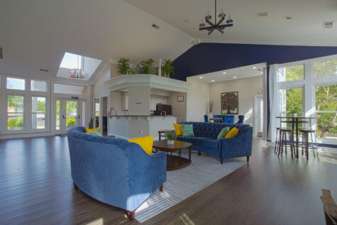 Bright and inviting clubhouse interior at Waterford Place Apartments in Loveland, Ohio, offering comfortable seating areas and community gathering spaces.