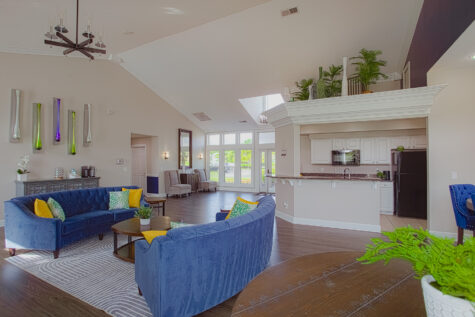 Bright and inviting clubhouse interior at Waterford Place Apartments in Loveland, Ohio, offering comfortable seating areas and community gathering spaces.
