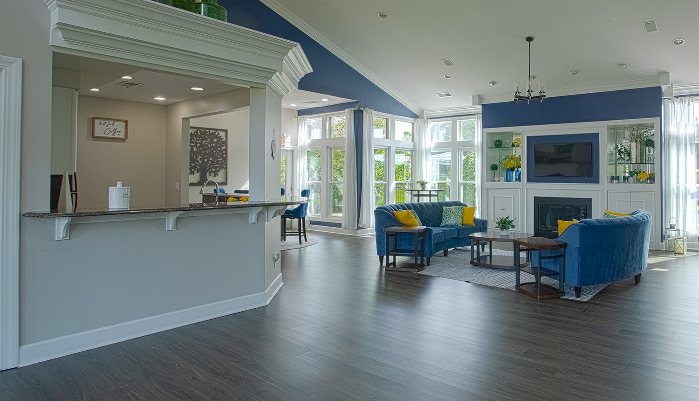Bright and inviting clubhouse interior at Waterford Place Apartments in Loveland, Ohio, offering comfortable seating areas and community gathering spaces.