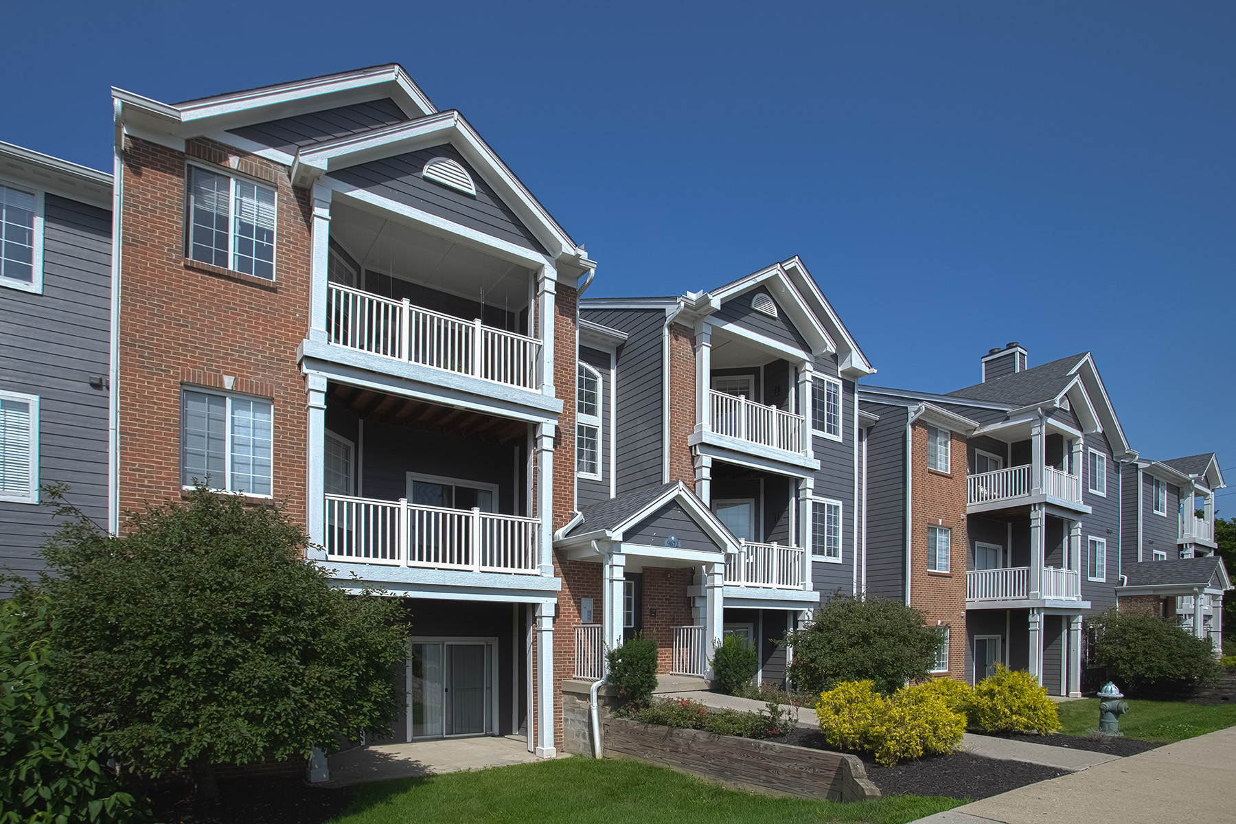 Scenic view of Waterford Place Apartments in Loveland, Ohio, highlighting attractive apartment homes, lush landscaping, and a welcoming neighborhood atmosphere.