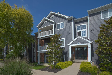 Beautifully landscaped grounds at Waterford Place Apartments in Loveland, Ohio, showcasing mature trees, manicured green spaces, and scenic community views.